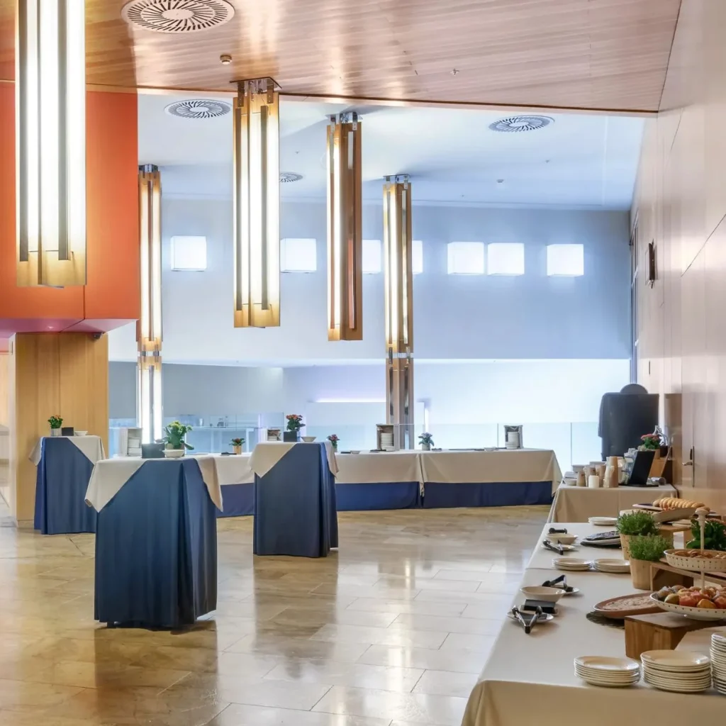 View of a modern event room with elegant tables and lights