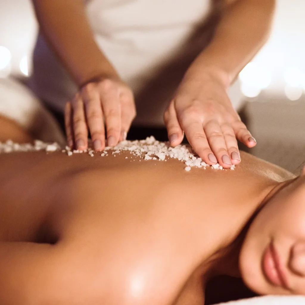 A wellness massage utilizing salt scrub for skin rejuvenation