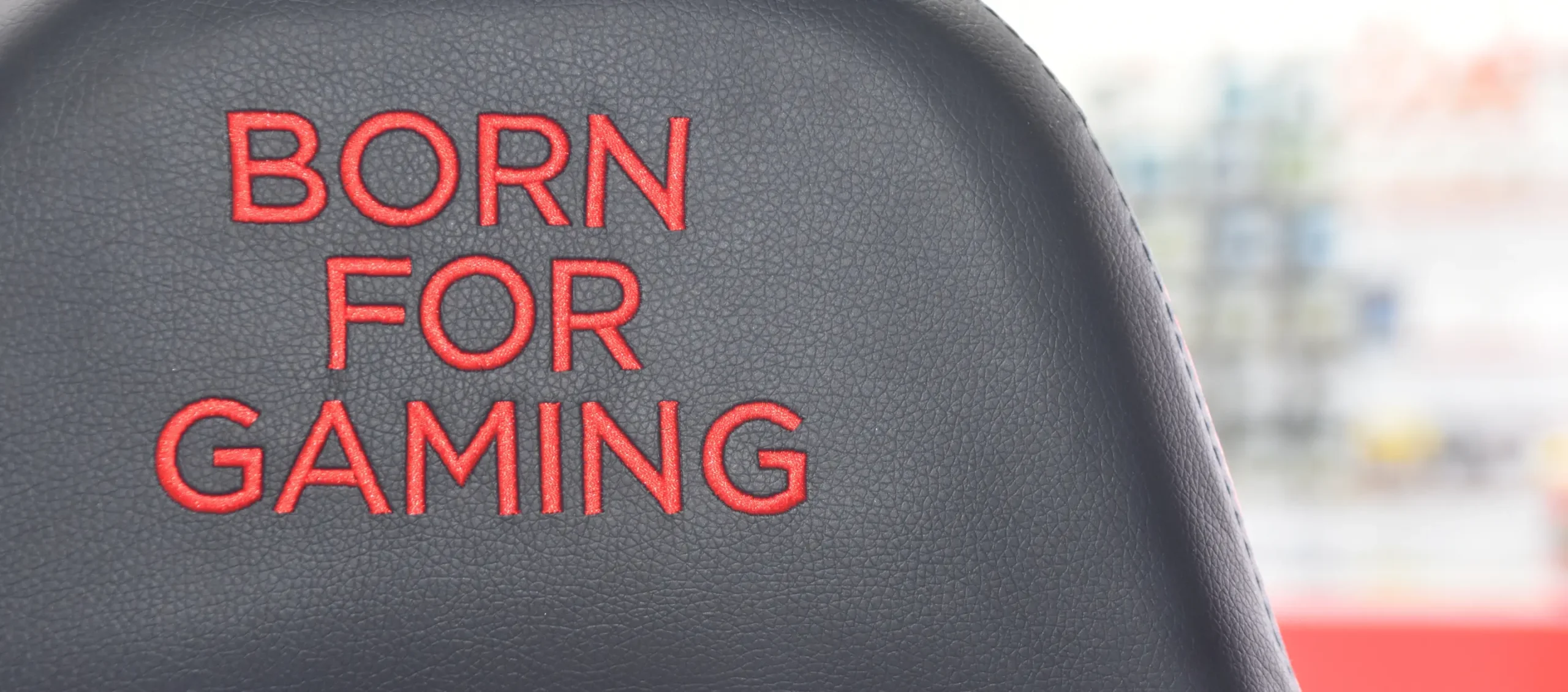 Gaming chair with the text 'Born For Gaming' in red on black background.