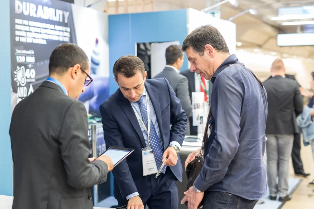 Attendees engaging in conversation at a business expo