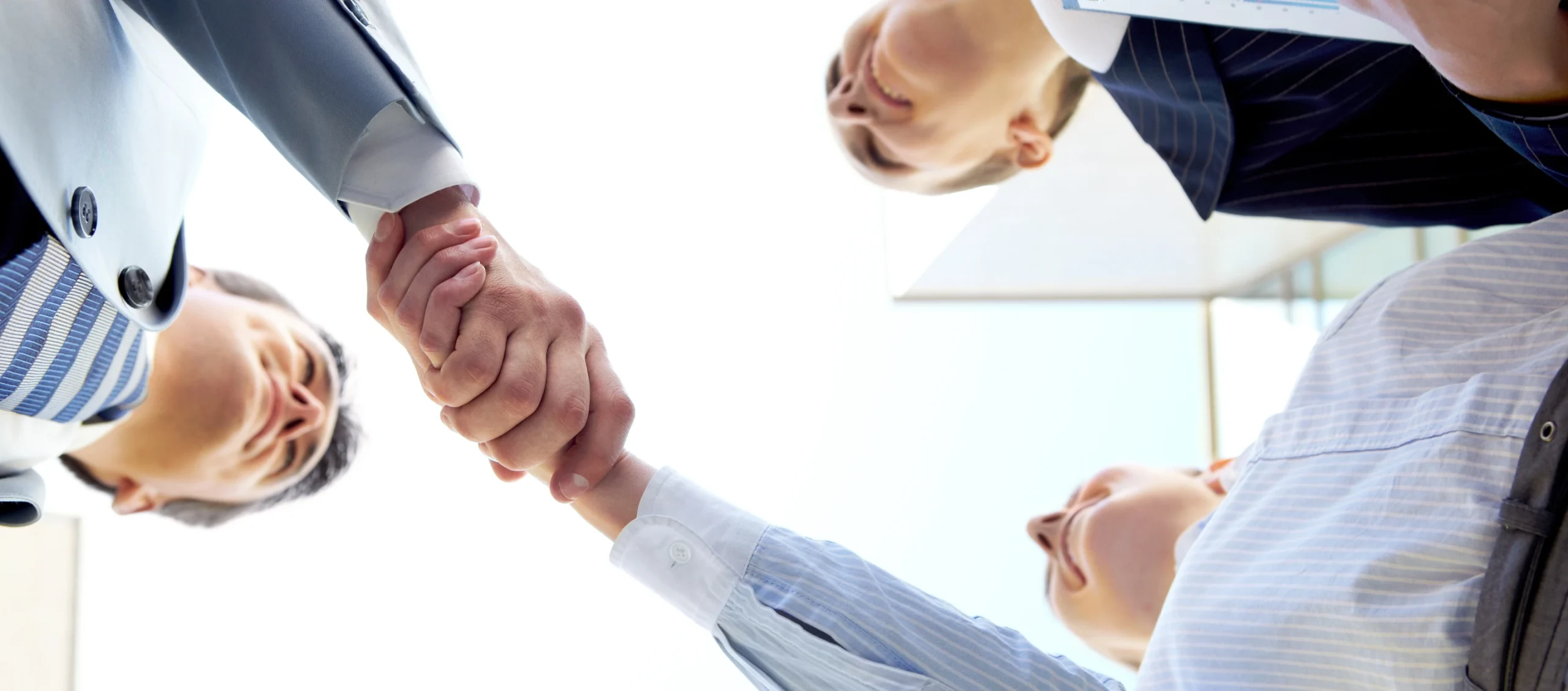 A business handshake between professionals in a meeting
