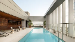 view of a modern rooftop swimming pool with elegant design