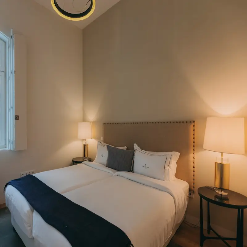 Bedroom of Torel Palace Lisbon, a luxury boutique palace hotel with a MICHELIN Star restaurant in the heart of Lisbon, with outstanding views over the city