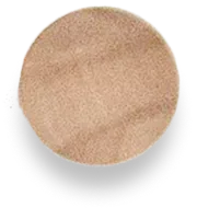 Beige, circular makeup powder on a white background with shadowing.