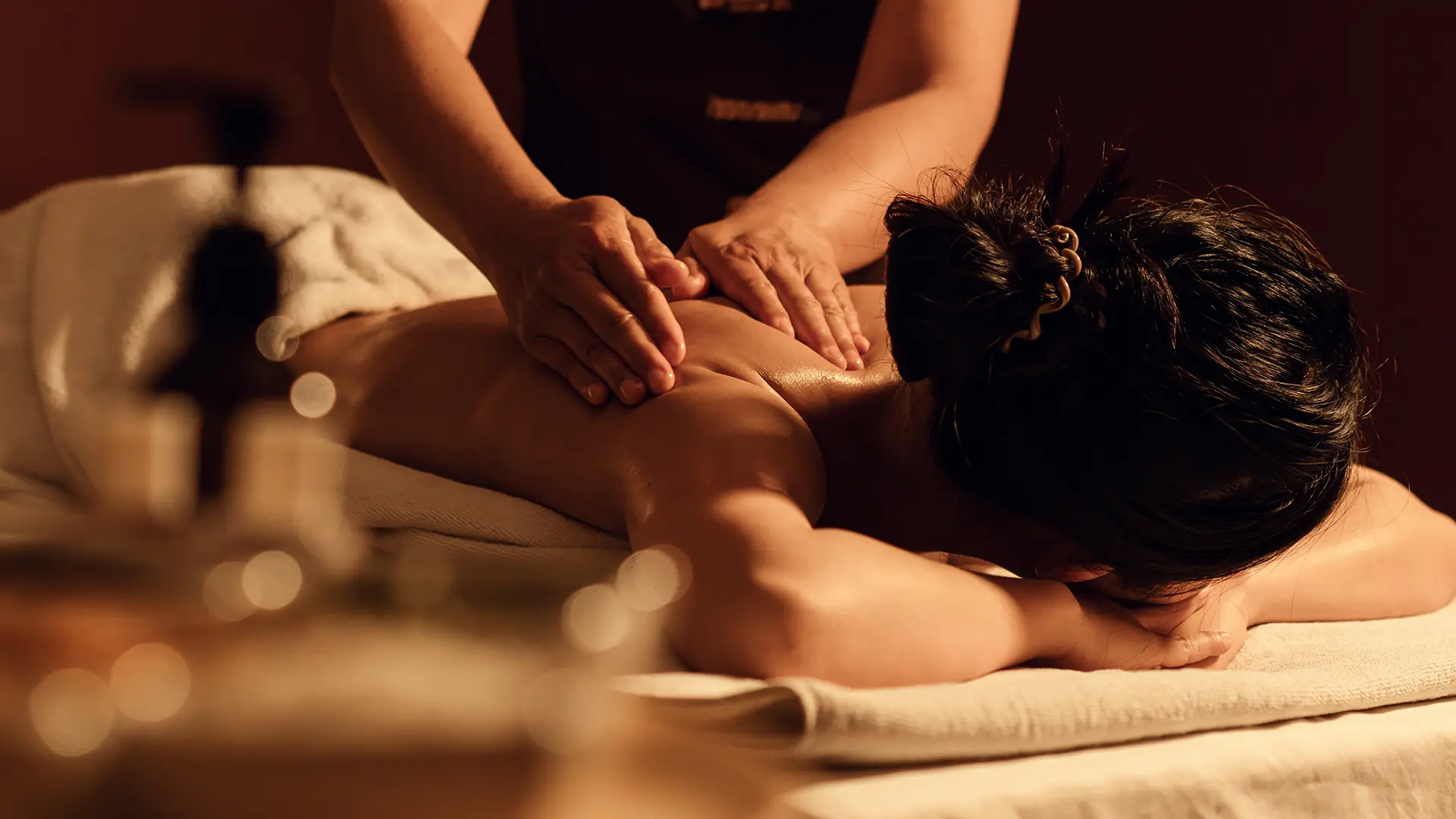 Woman receiving massage in spa treatment