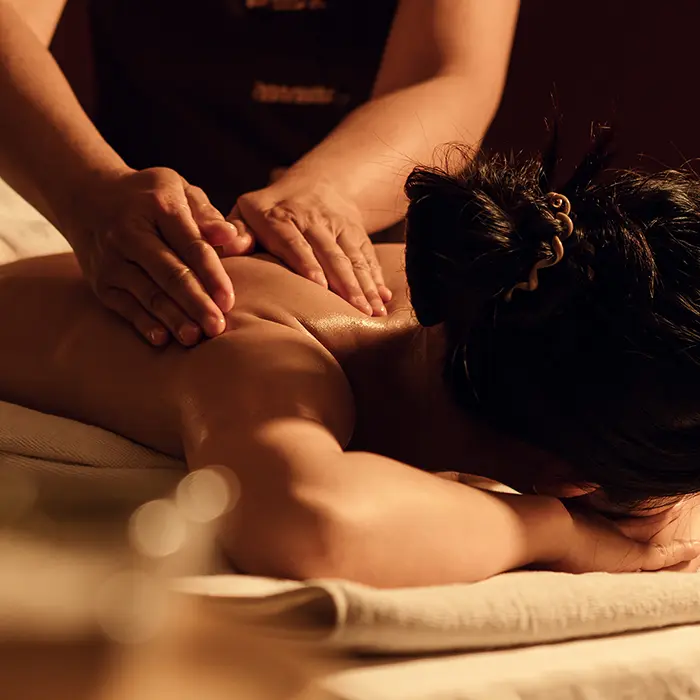Woman receiving massage in spa treatment