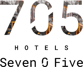 "Number 705 with embedded image of a street with a yellow tram and buildings."
