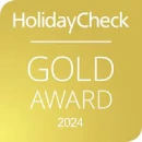 HolidayCheck 2024 Gold Award logo on a gold background.