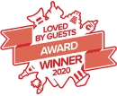 Red award badge: "Loved by Guests Award Winner 2020" with cityscape icons.