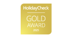 Logo del "HolidayCheck GOLD AWARD 2025" con fondo dorado.