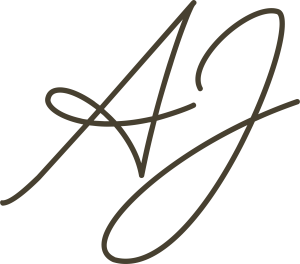 "Stylized 'AJ' logo in elegant, flowing script on a transparent background."