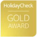 HolidayCheck Gold Award logo on a golden background.