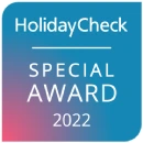 HolidayCheck Special Award 2022 badge, blue and pink gradient.