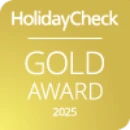 HolidayCheck Gold Award 2025 logo on a yellow background.