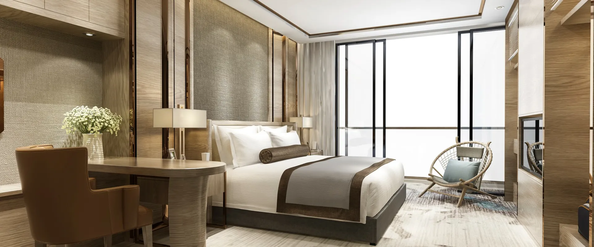 Habitación moderna y luminosa con cama, escritorio, silla y ventanales grandes.