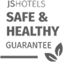 "Logotipo: JS Hotels Safe & Healthy Guarantee con hojas al lado."