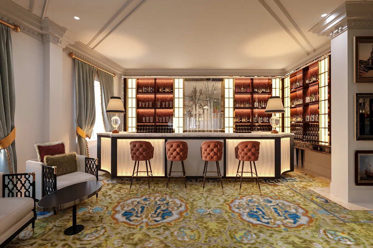 Bar elegante con sillas acolchadas y estanter&iacute;as iluminadas.