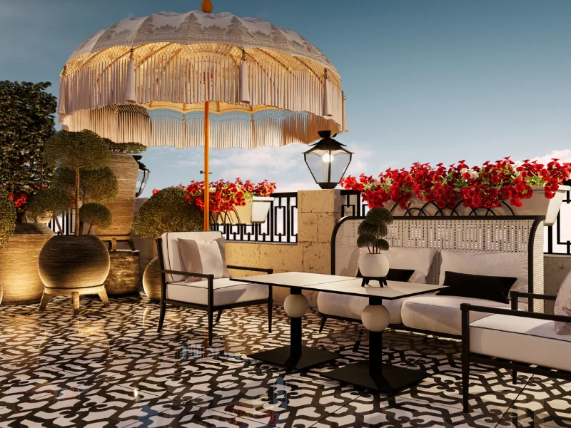 Terraza con sombrilla, muebles elegantes y flores rojas al atardecer.