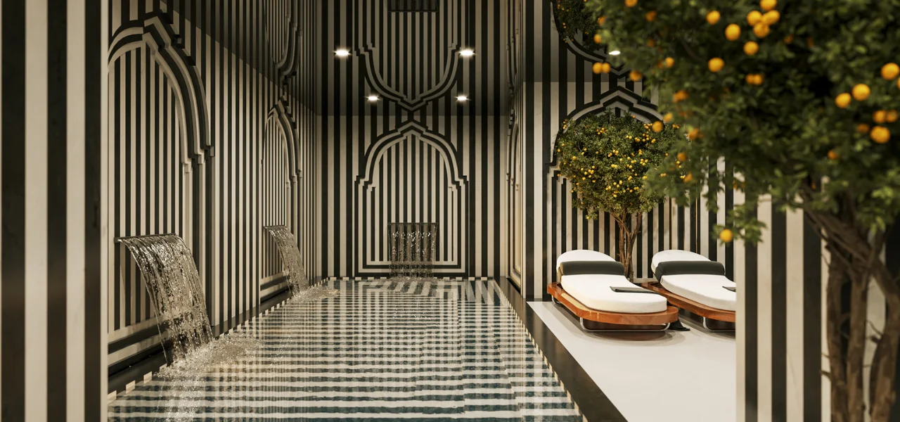 Spa con paredes a rayas y fuentes de agua, &aacute;rboles y camillas blancas.