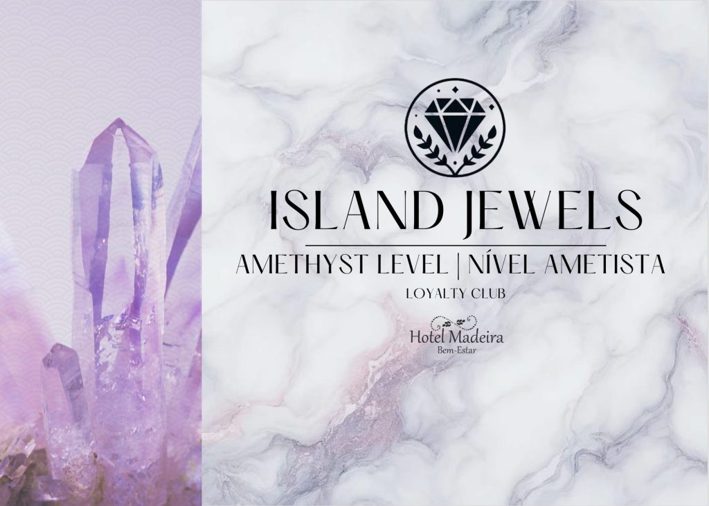 Amethyst crystal with "Island Jewels" text on a marble background.