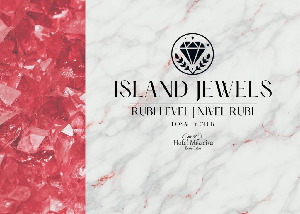 Red crystals and Island Jewels loyalty club on marble background.
