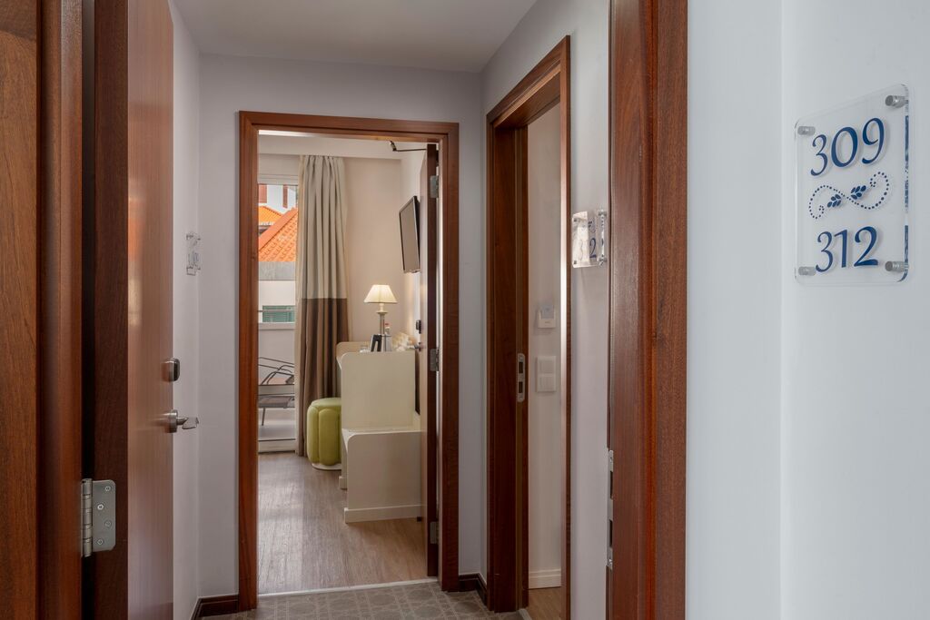 Hallway leading to room with numbers 309 and 312 visible on the wall.