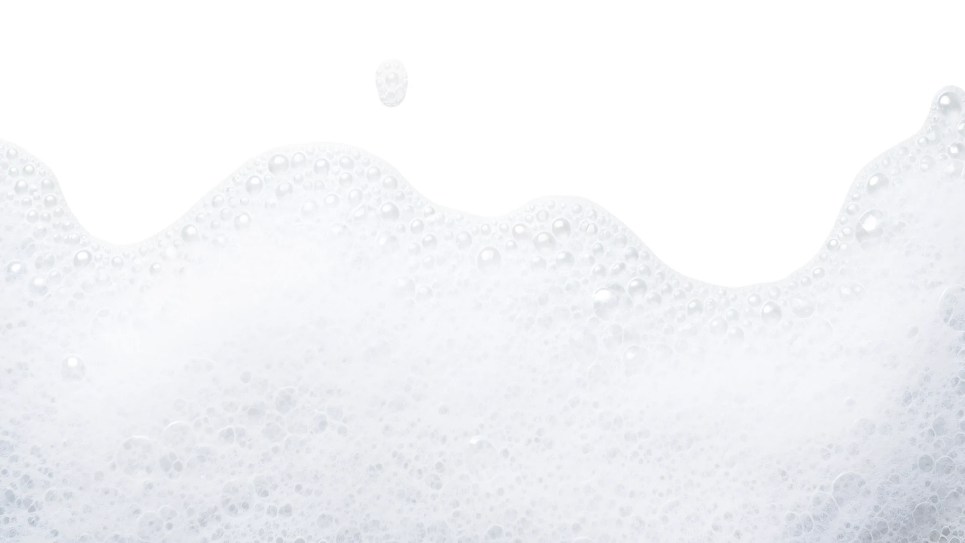 Espuma blanca con burbujas en fondo blanco.