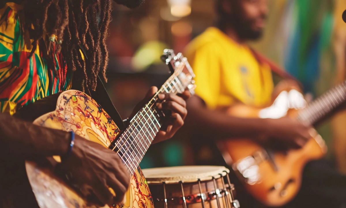 Two Jamaican guitarists playing