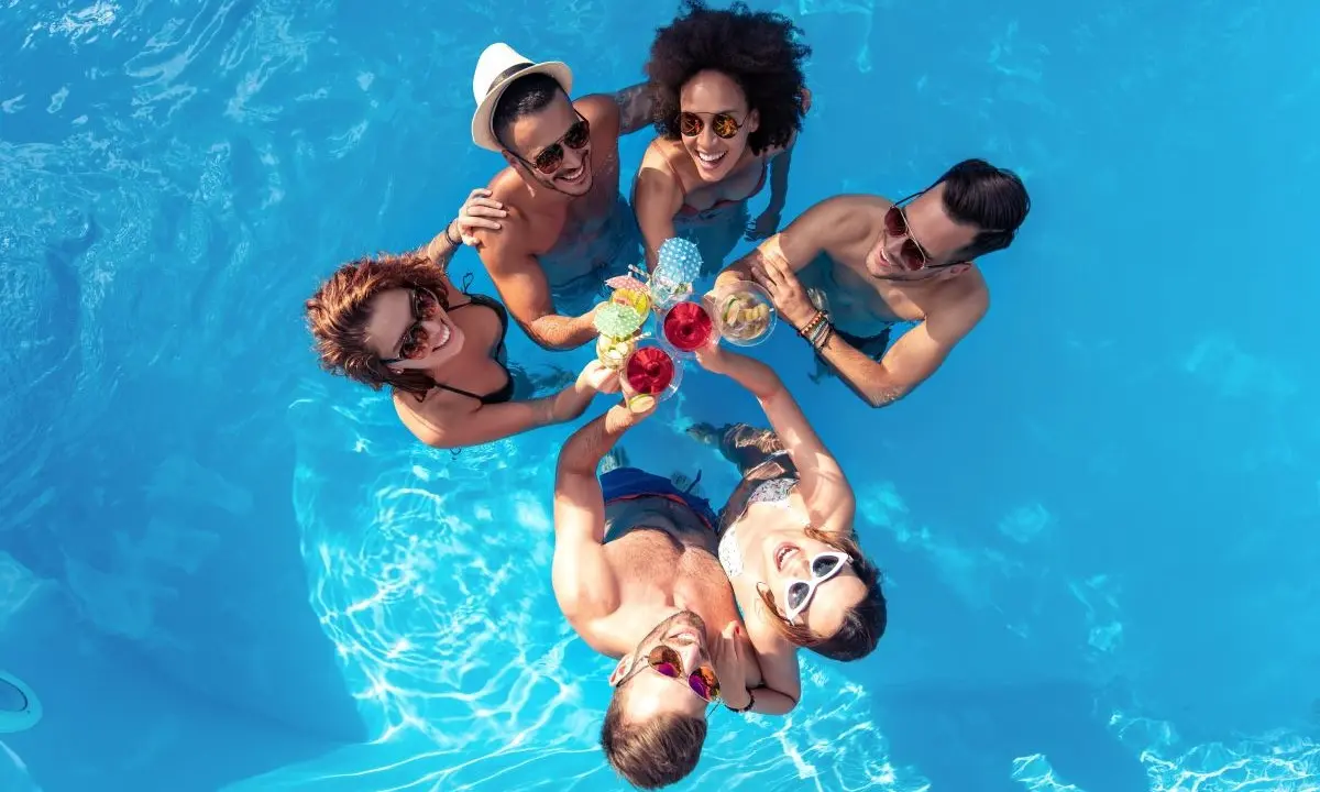 A group of friends enjoying their holiday in a private pool
