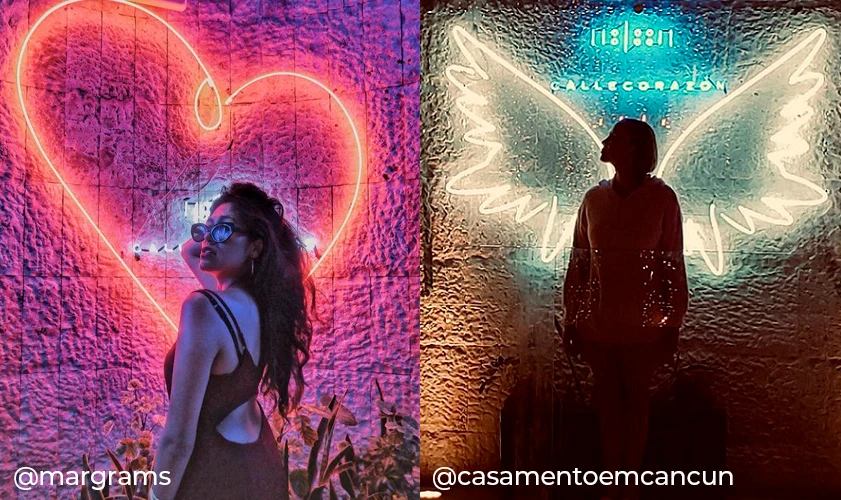 Dos personas frente a murales ne&oacute;n: coraz&oacute;n y alas con @margrams/@casamentoemcancun