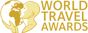 Logotipo &ldquo;World Travel Awards&rdquo; con figuras de planeta y perfil humano