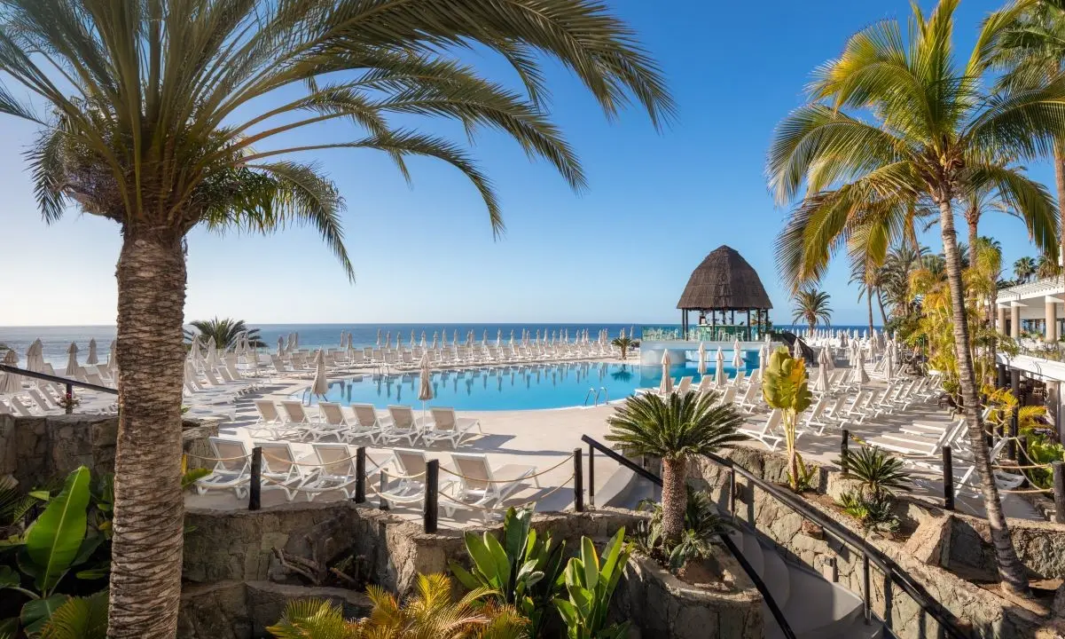 Main pool at Princess Taurito Hotel, overlooking the sea, with pool bar, sunbeds and parasols