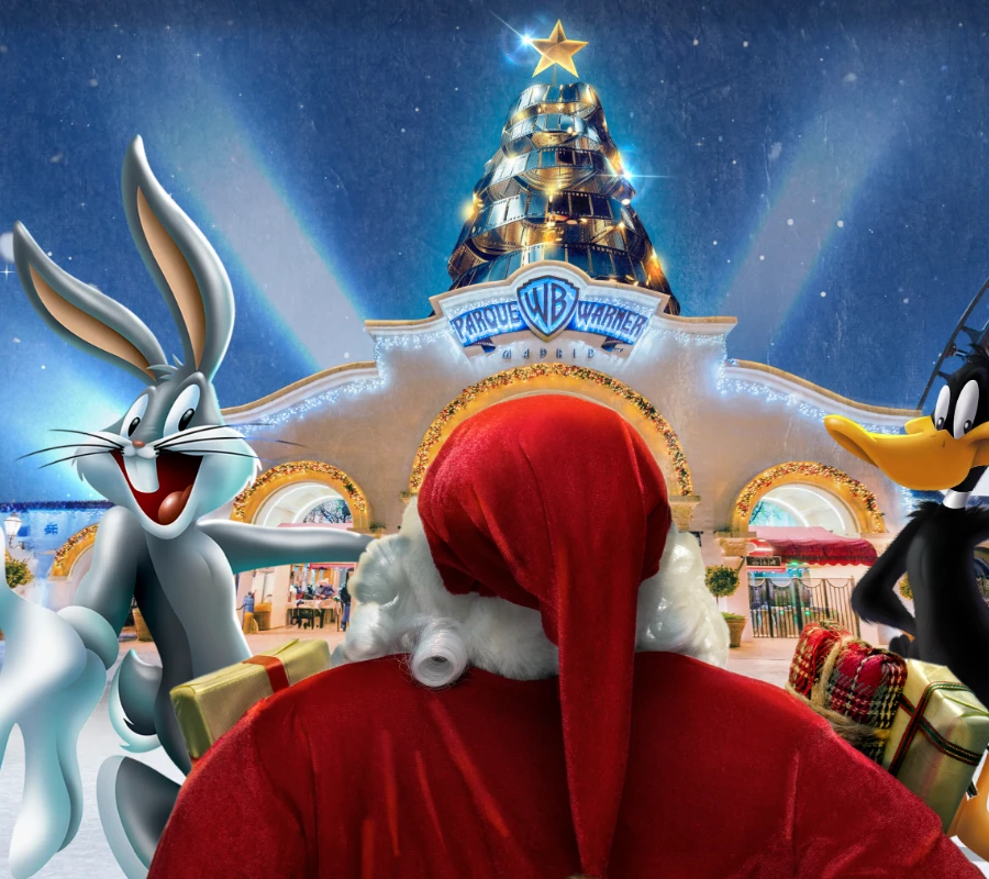 Santa con regocijo navide&ntilde;o en Parque Warner, junto a dos personajes animados.