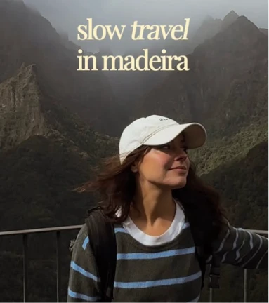 Woman enjoying mountain view, "slow travel in madeira" text above.