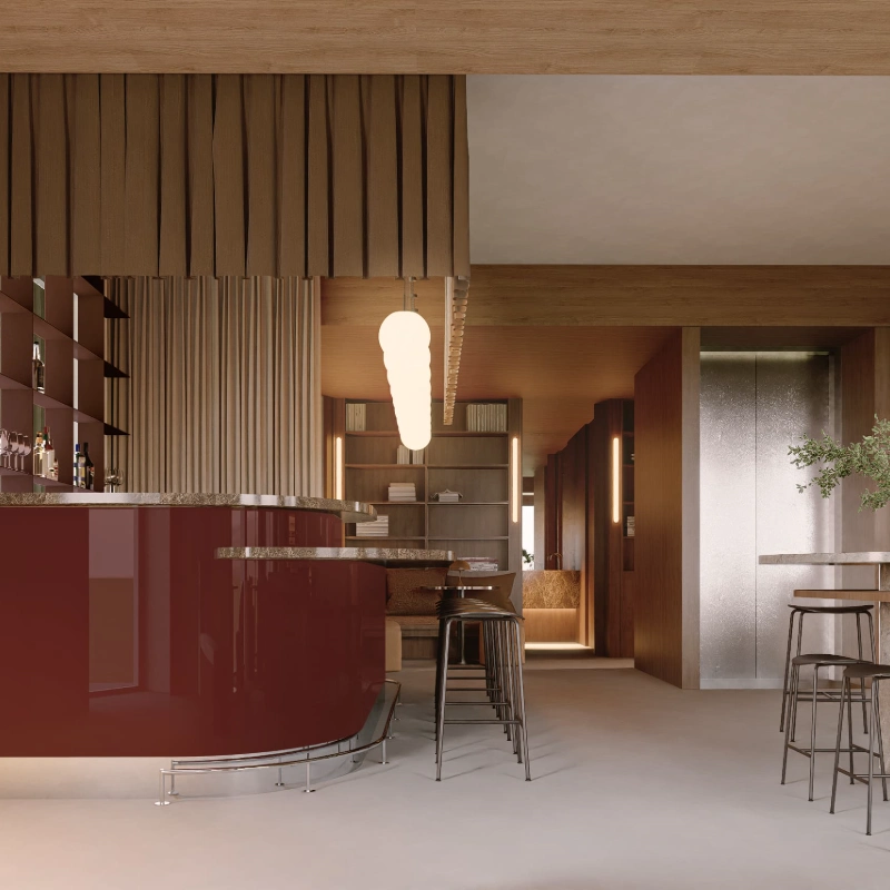 Bar moderno con barra curva, luces y taburetes de metal.