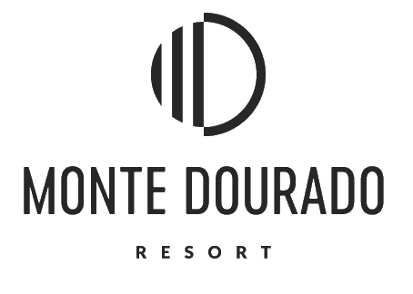 Monte Dourado Resort logo with a circular design above the text.