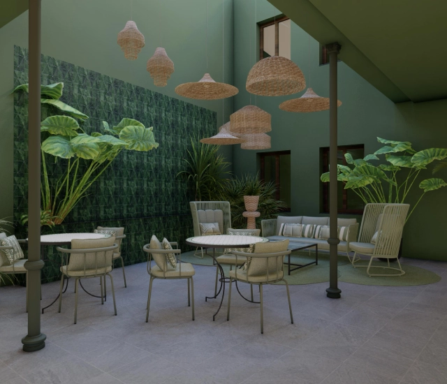 Patio moderno con muebles y plantas grandes, decorado en tonos verdes.