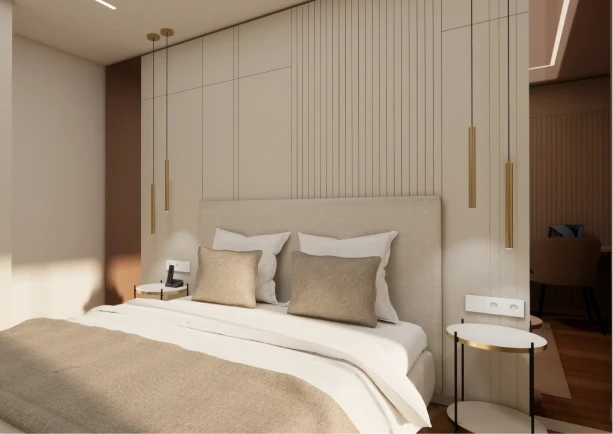 Modern bedroom with neutral tones, pendant lights, and a neatly made bed.