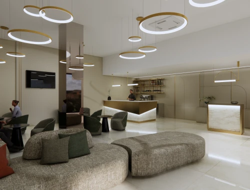 Modern hotel lobby with seating, circular lights, and reception desk.