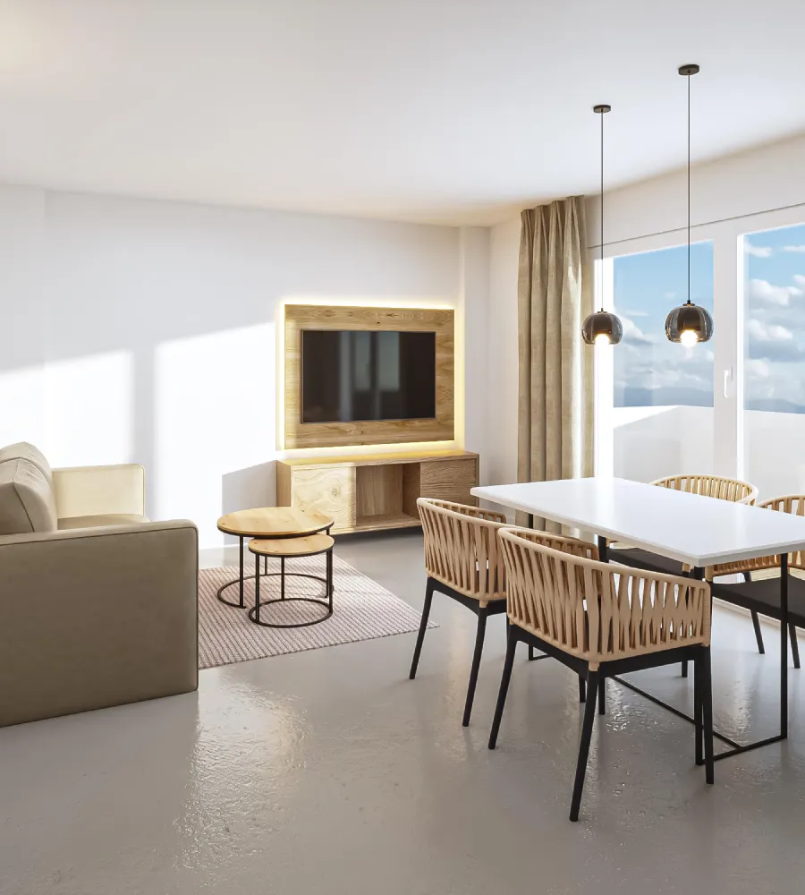 Sala moderna con sof&aacute;, mesa de comedor y ventana luminosa.