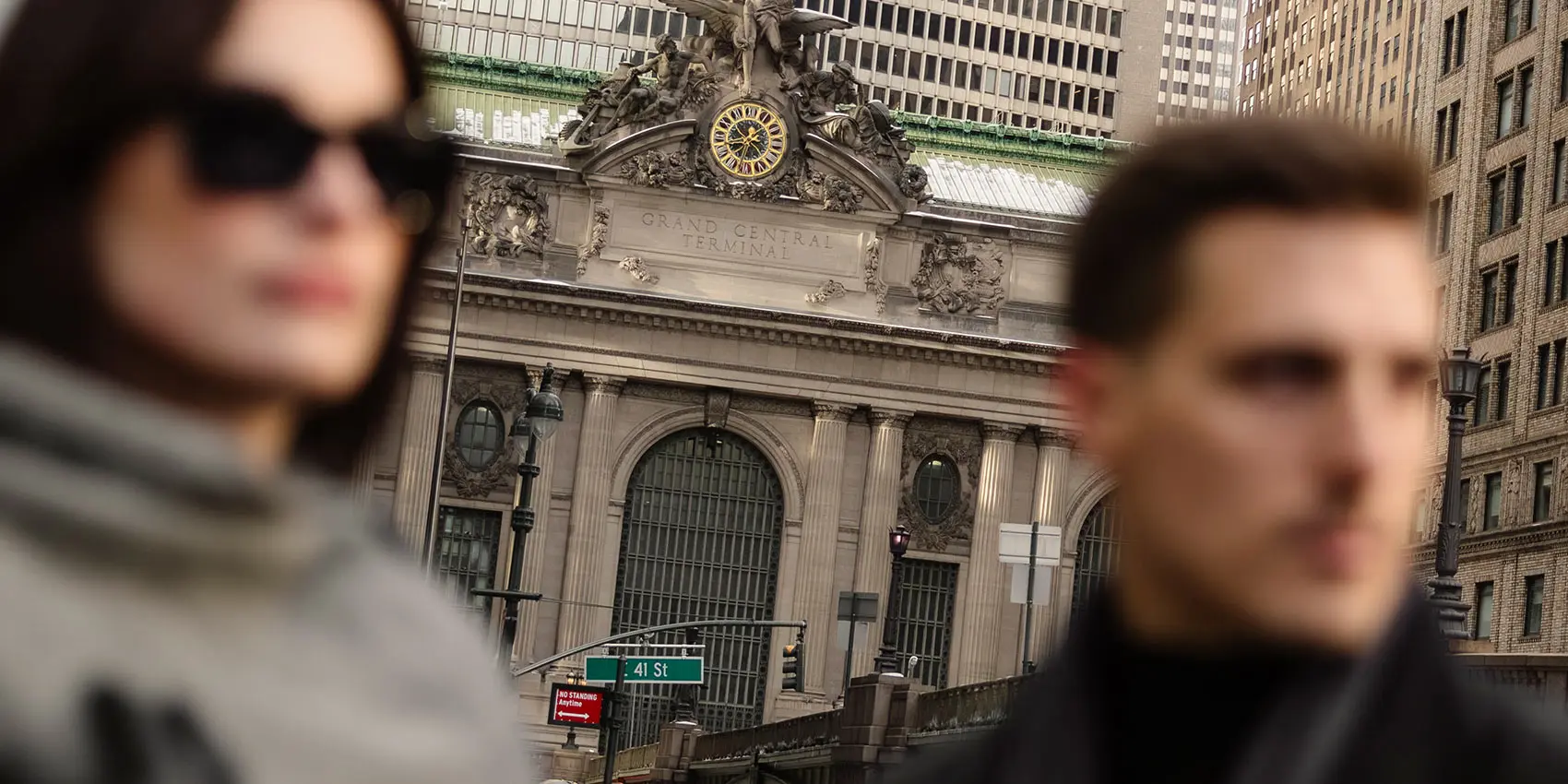 Grand Central Terminal entrance with “Grand Central Terminal” sign, blurred people