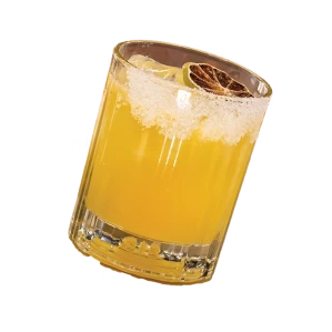 Glass of yellow cocktail with ice and a salted rim on black background
