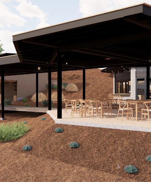 Outdoor modern patio with wooden chairs under a covered roof.