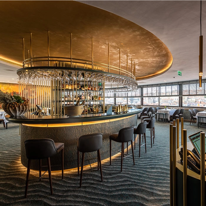 Sophisticated bar with circular counter and golden lighting in a modern restaurant