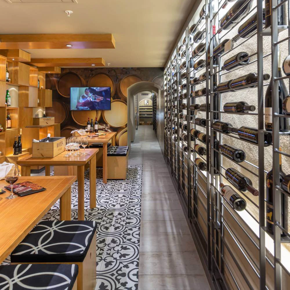Wine cellar with wine corridor, tables, and elegant decoration in the dining room