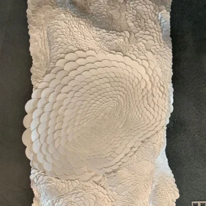 Superficie texturizada con c&iacute;rculos blancos en patr&oacute;n espiral.